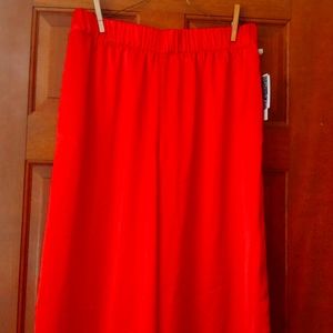 Orange satiny elastic waist pants.